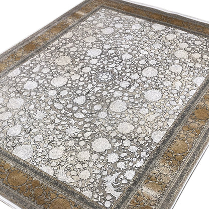 Silver-gold carpet with floral motifs and a border, viewed from above at an angle
