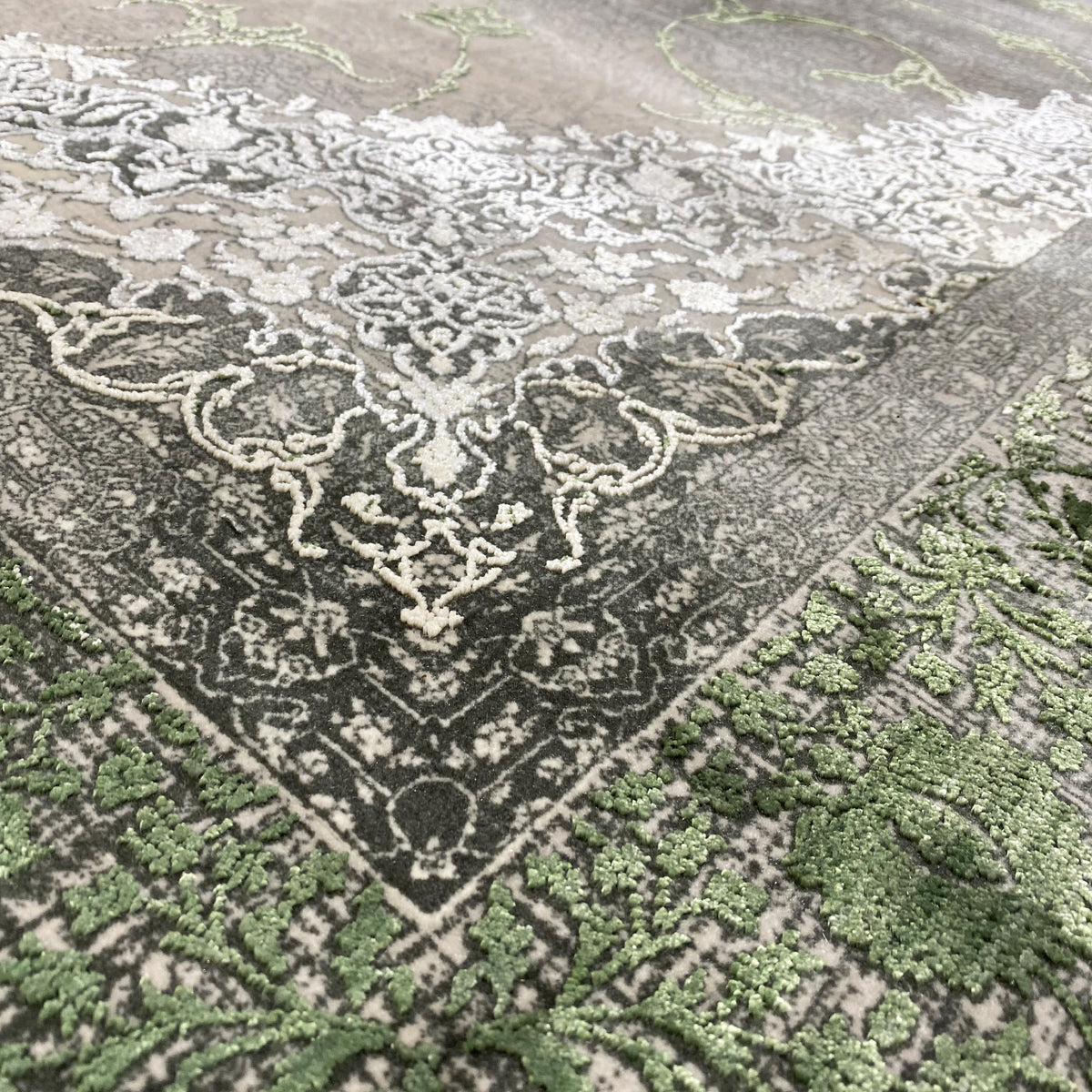 Woodland spirit rug 170x240 cm detail view: high-contrast ornaments in green and cream