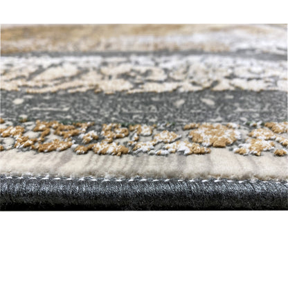 Carpet edge with a fine pile and bound border; pattern in beige, silver, and dark gray.