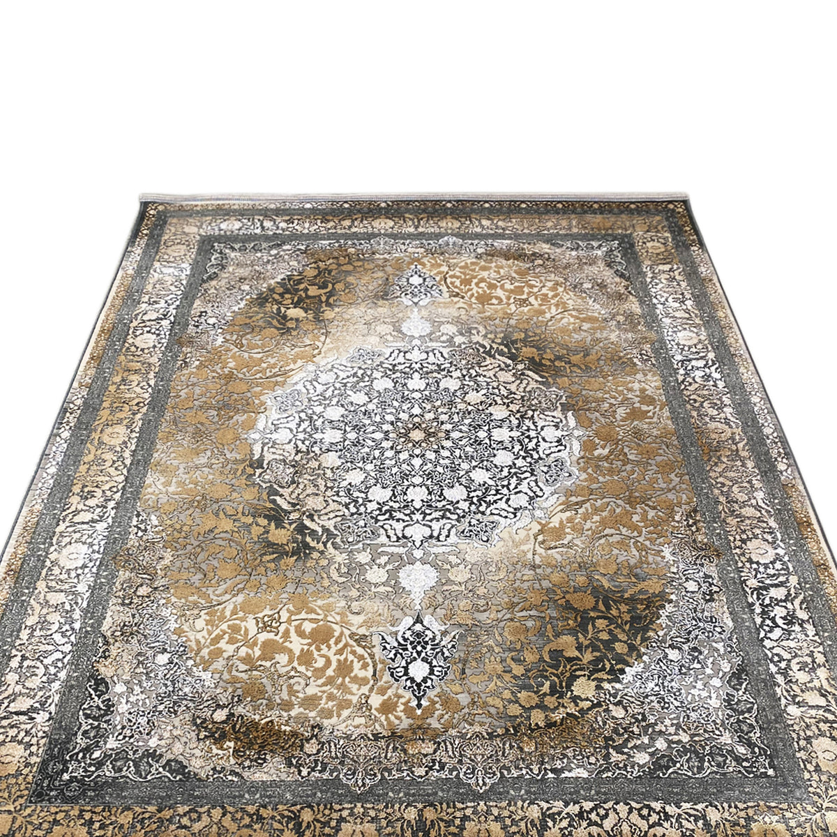 Rectangular rug with a symmetrical ornamental pattern in gold and silver tones on a dark gray background.