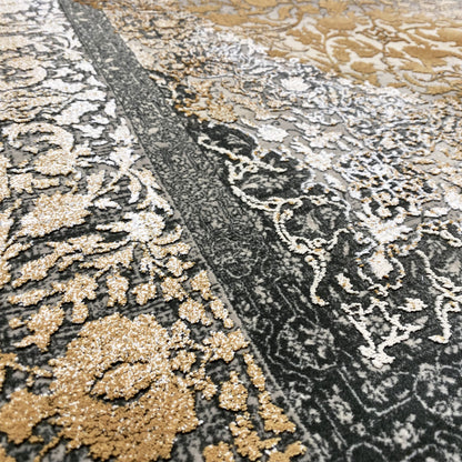 Rug detail: high-contrast pattern with gold accents and dark gray ornamental lines.