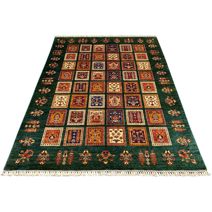 Green khorjin rug with a square ornamental pattern and fringes on the sides