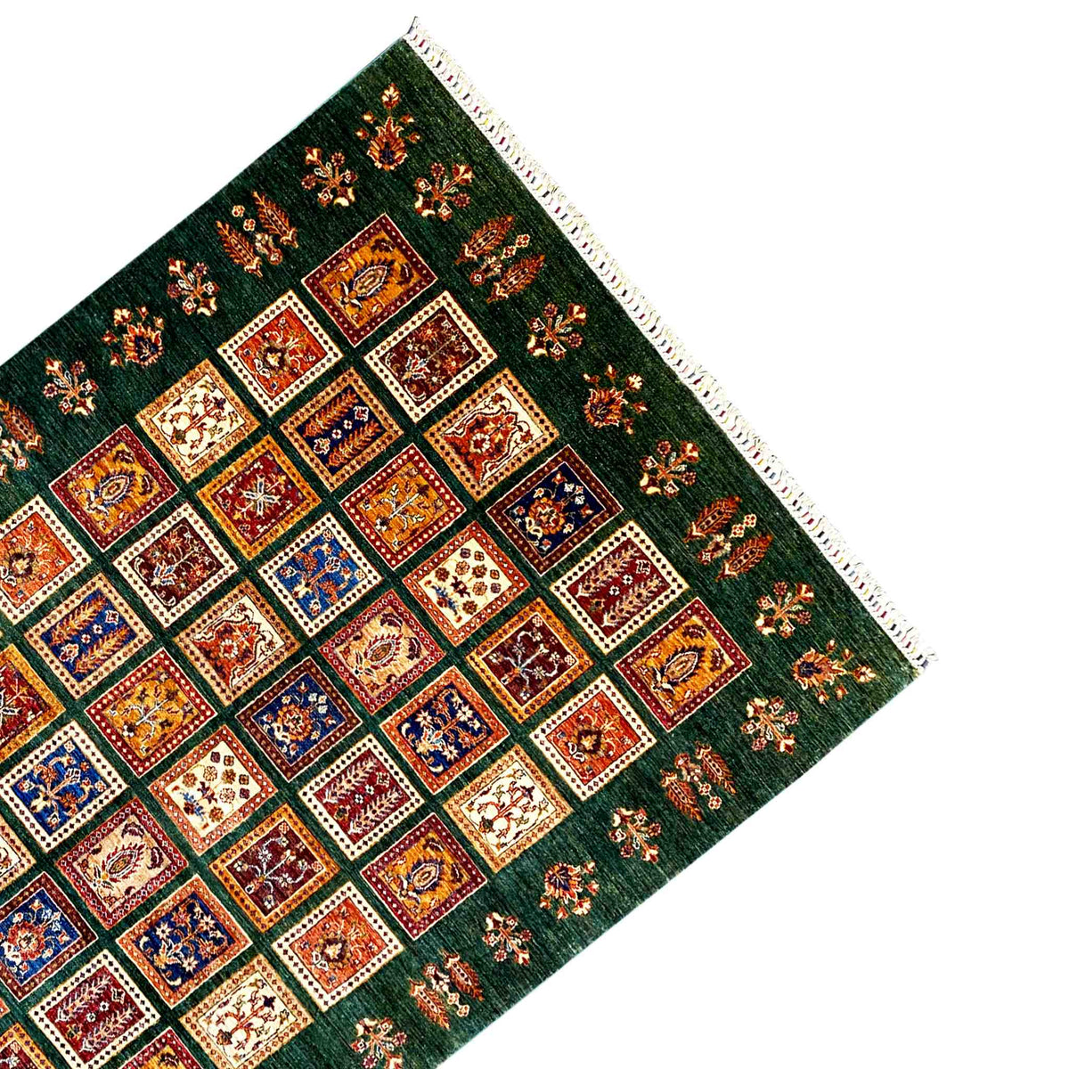 Khorjin rug corner with a dense pattern and fringed trim along the edge