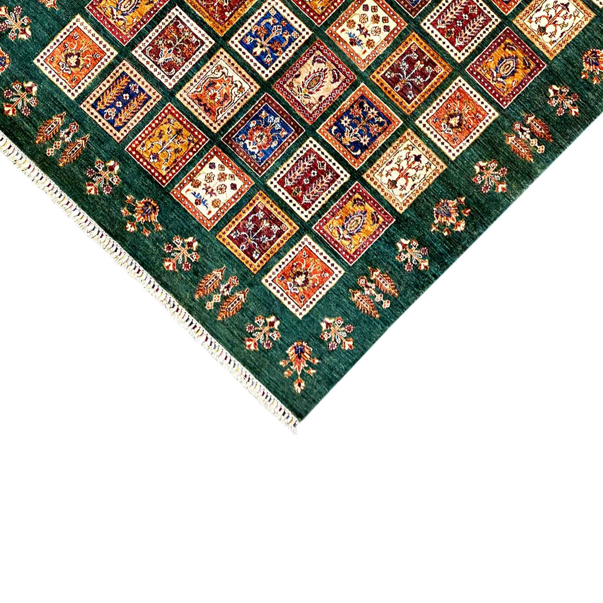 Green khorjin rug with a detailed square pattern and fringes at the corners