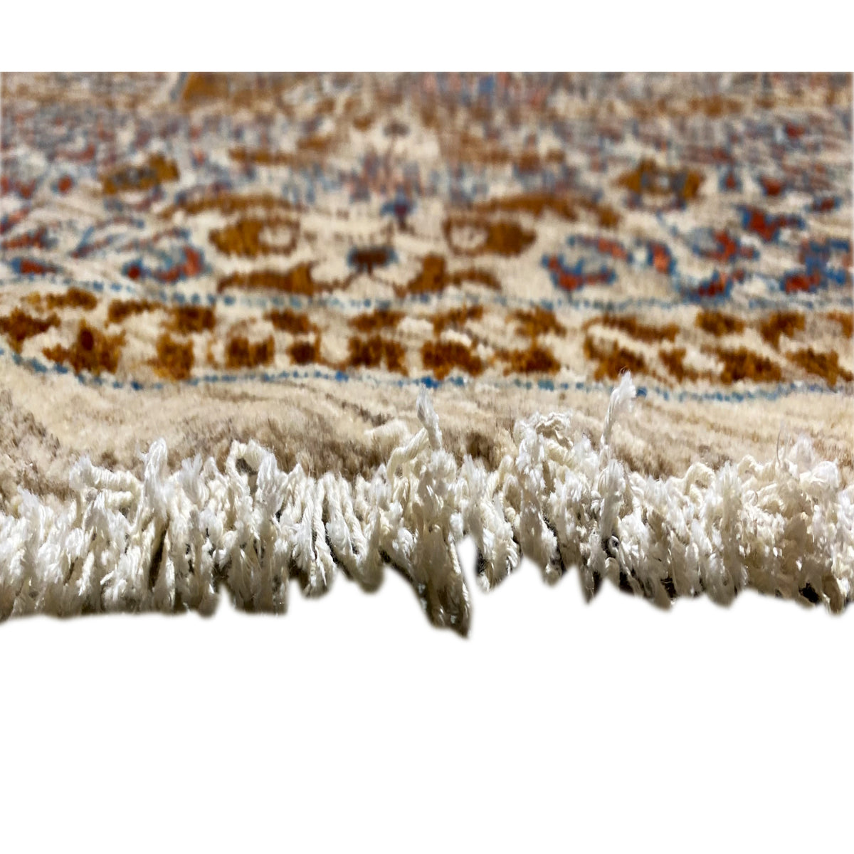 Rug edge with a high pile and tassels, beige and white, blue/brown patterned stripe