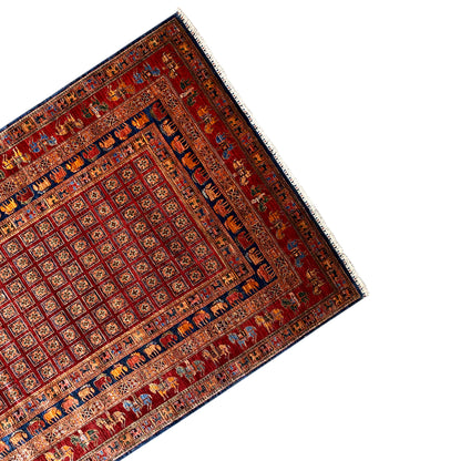Reddish-brown Oriental rug viewed from above at an angle, central field and border frame