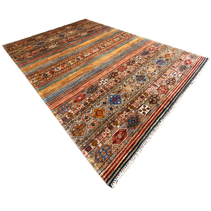 Colorful khorjin rug, laid out diagonally, with ornamental elements and multicolored stripes.