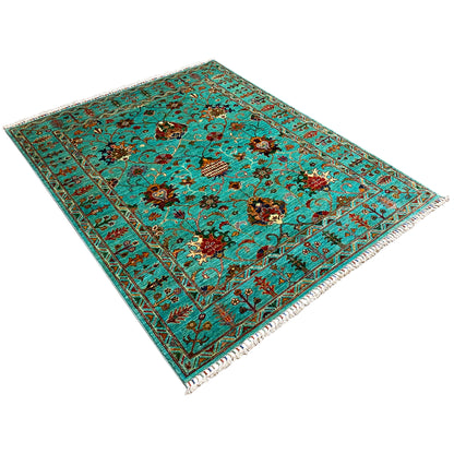 Turquoise Khorjin rug at an angle: floral medallions, floral ornaments, border