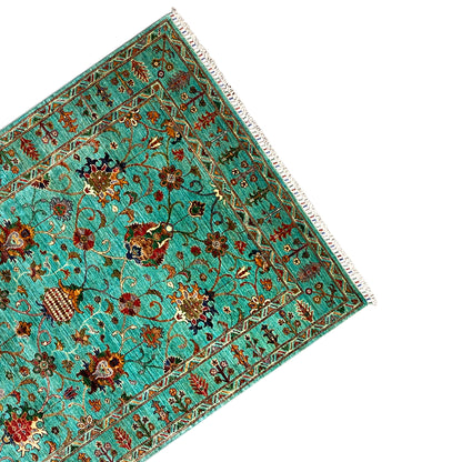 Turquoise Khorjin rug, side view: border, vines, and central floral medallions