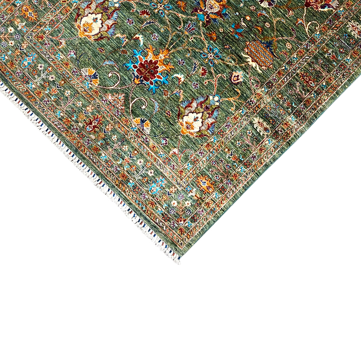 Corner detail: Khorjin rug with fringes and fine ornamental lines