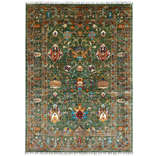 Khorjin rug in dark green with colorful ornamentation and fringes