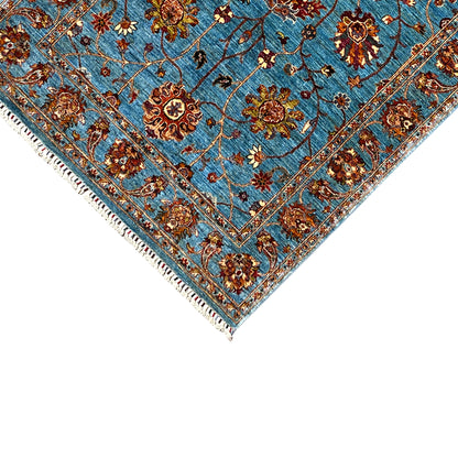 Blue Khorjin rug corner detail with medallion, decorative lines, and fringes