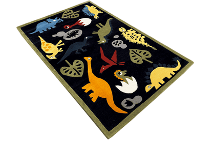 Children's rug with dinosaur motifs, dark blue, photographed at an angle, 120x180 cm