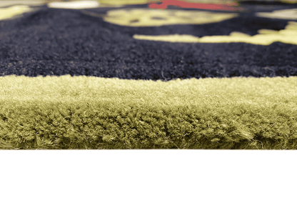 Carpet pile in detail at the edge, dark blue pattern, greenish-yellow pile