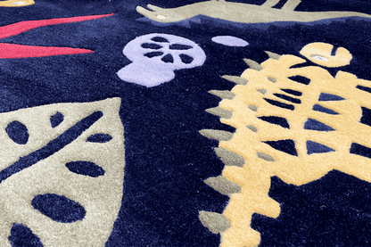 Close-up: colorful dinosaur graphic on a dark blue children's rug