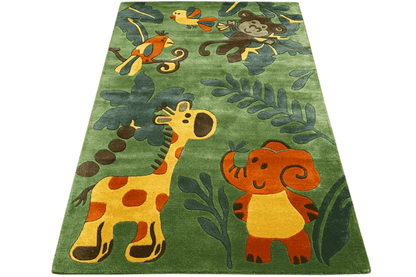 Rectangular children's jungle rug in green with giraffe, elephant, and leaf motifs
