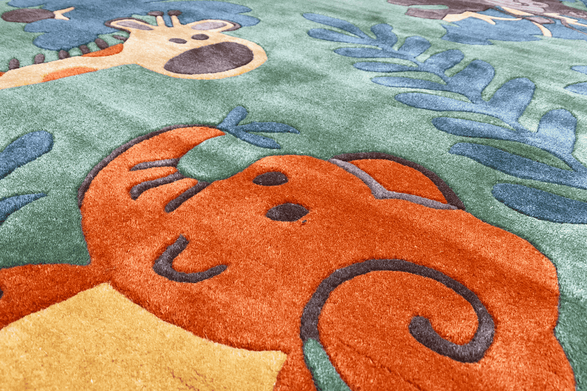 Carpet detail with an orange animal motif on a green background