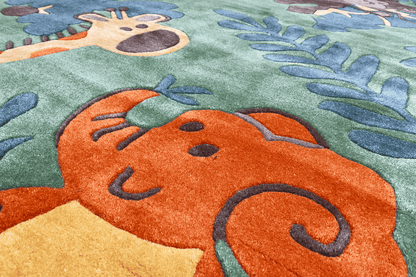 Carpet detail with an orange animal motif on a green background