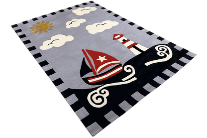 Children's sailing boat rug in an angled view: gray background with a sailboat, clouds, and border