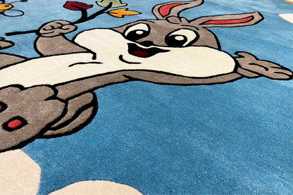 Close-up: drawn bunny face and paws on a blue carpet