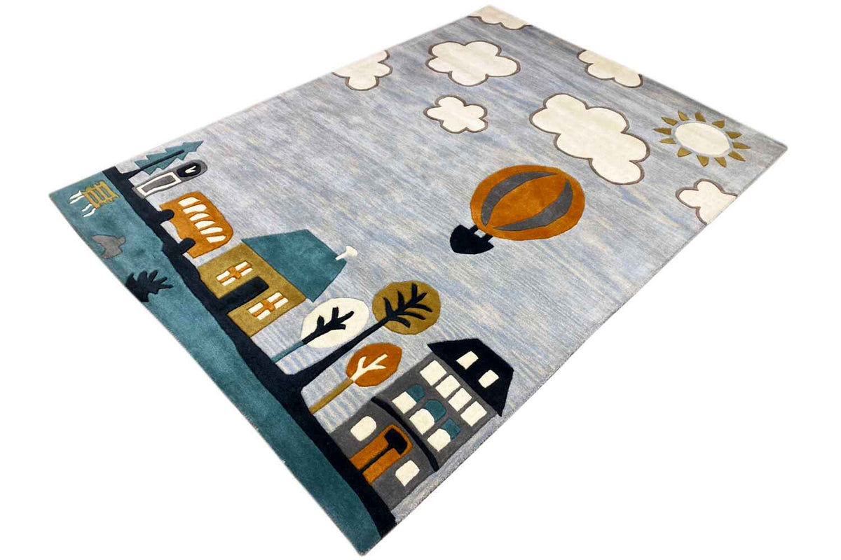 Hand-tufted wool rug with a hot-air balloon, houses, sun, and clouds.