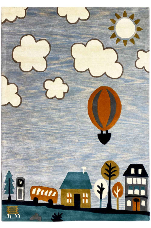 Hand-tufted wool rug with a hot-air balloon, clouds, and city houses in a children's design.
