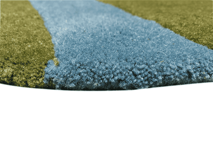Children's rug with blue border and dense pile, close-up view of the rug surface