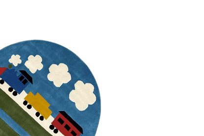 Round children's rug, detail with a locomotive and white clouds on a blue background