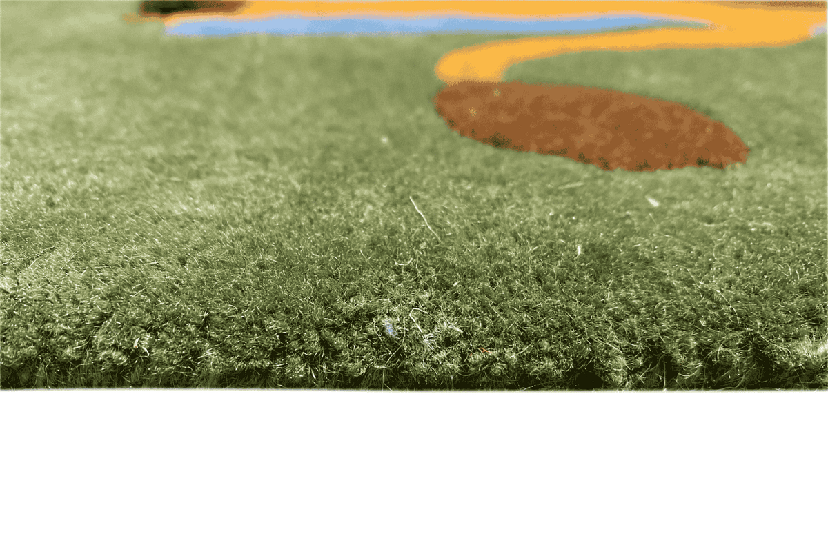 Close-up of the green pile with short fibers on a children's room rug