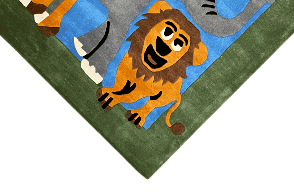Children's room rug close-up: lion with part of the elephant motif