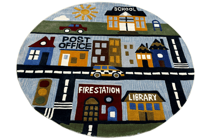 Round children's city rug with “Post Office,” “School,” and “Library” in shades of blue