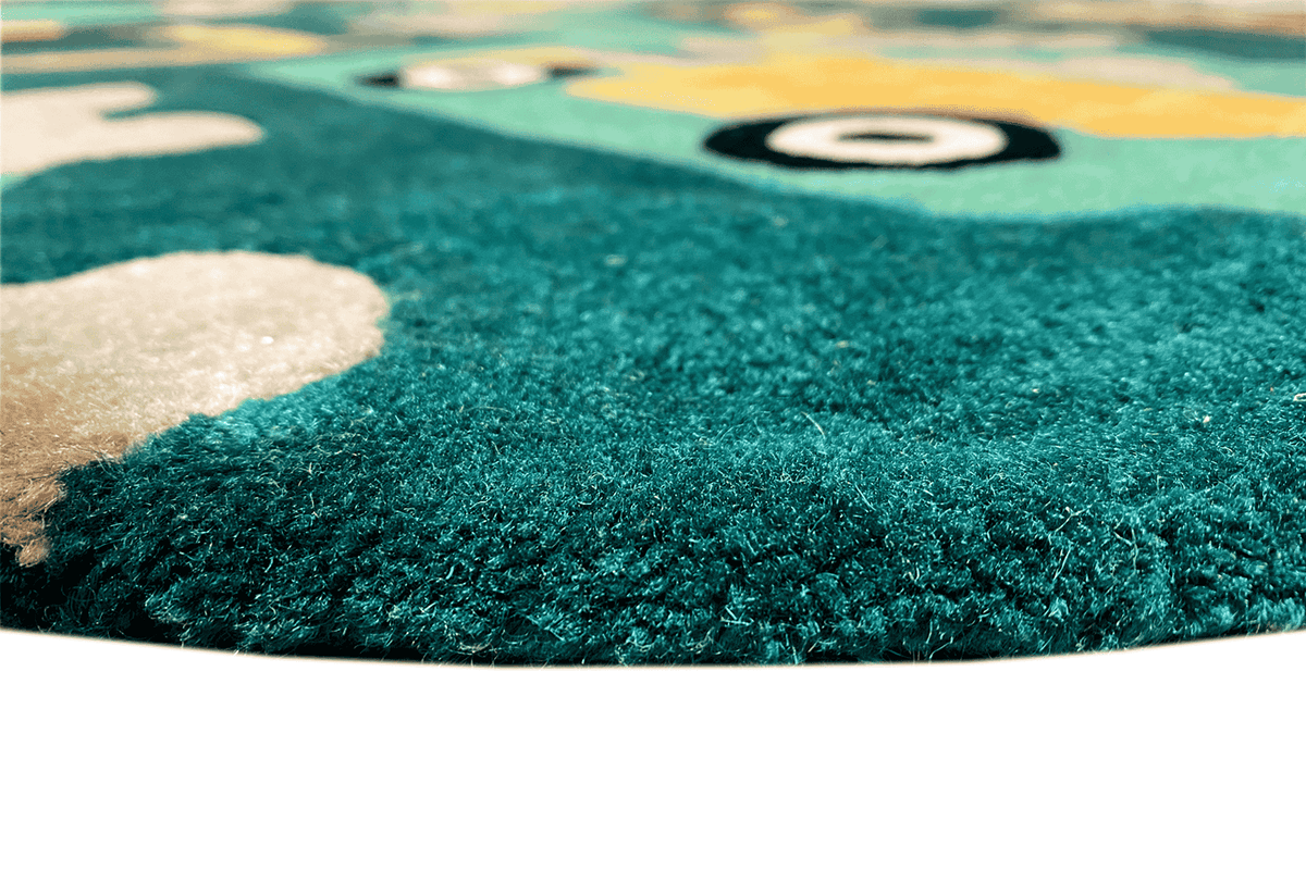 Children's digger carpet: close-up of the turquoise pile area with a colorful pattern