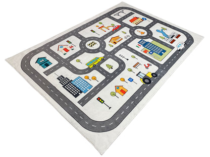 Kinderteppich mit Straßen und Fahrzeugen, Kreisverkehr, Gebäuden und Ampeln im Muster.