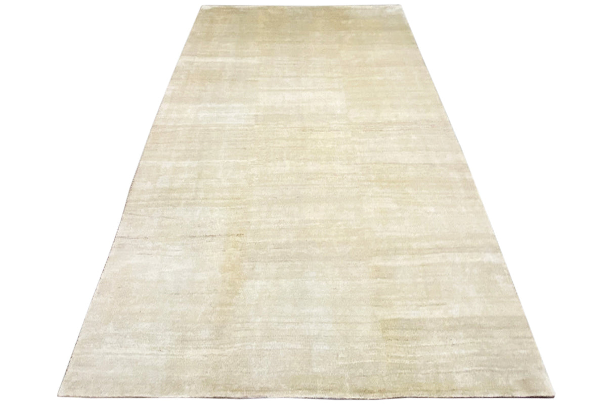 Light beige Gabbeh rug, rectangular, subtle linear pattern with a fine texture
