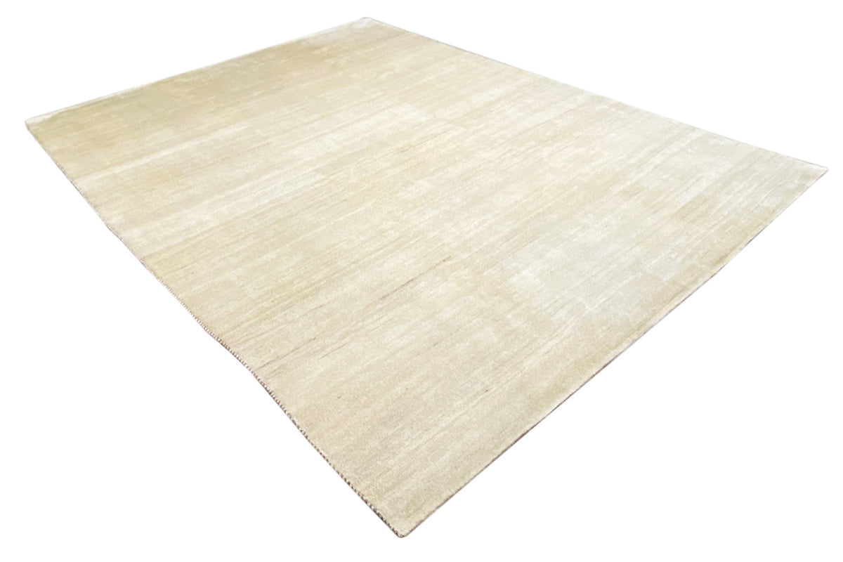 Light beige Gabbeh rug, presented diagonally, with a fine line and texture pattern