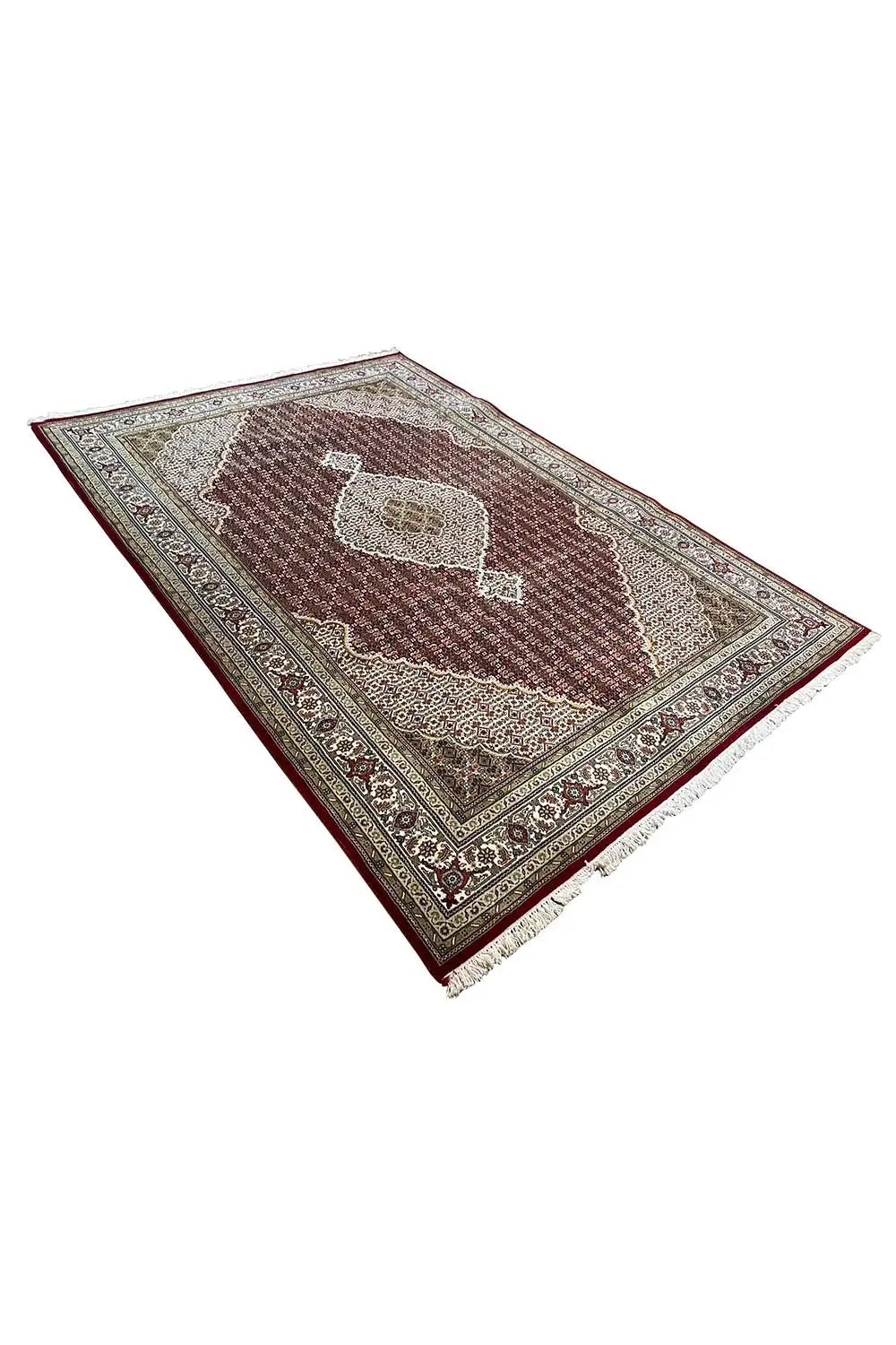 Rug with a Tabriz pattern, brown center with a large beige medallion, framed