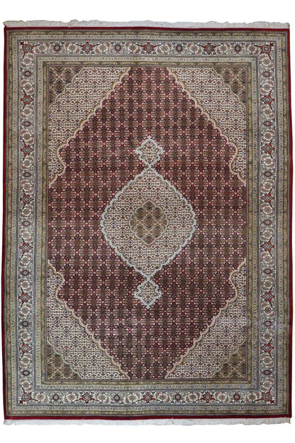 Rectangular rug with Tabriz pattern: brown medallion, dark red border