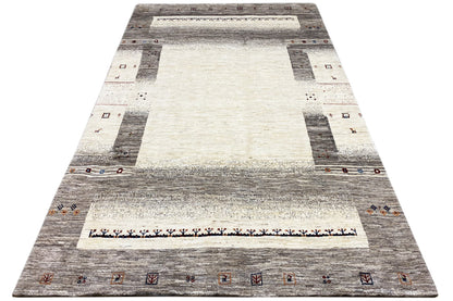 Gabbeh rug in A-shape perspective, gray-white with central medallion and border