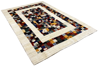 Gabbeh rug 299x200 cm, photographed at an angle: central geometric pattern on cream