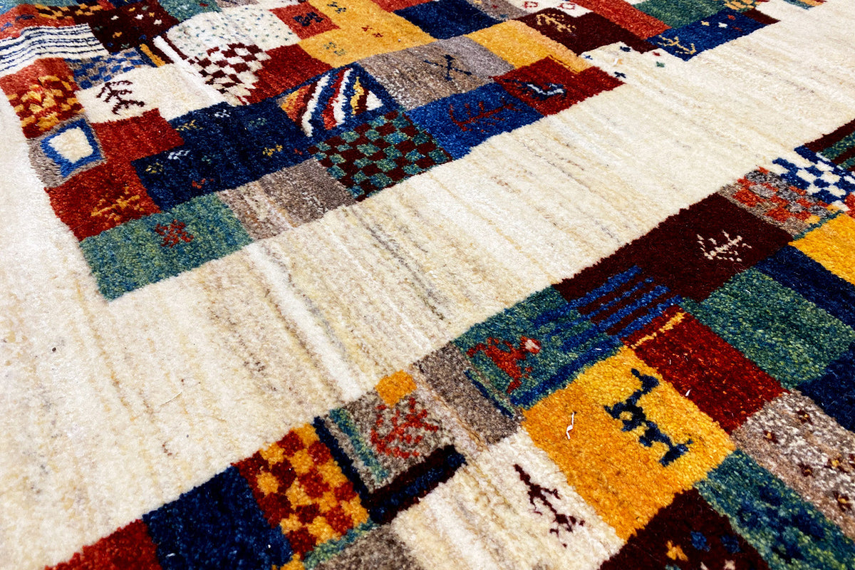 Gabbeh rug 299x200 cm: pile texture and patchwork motifs in blue, red, green and cream