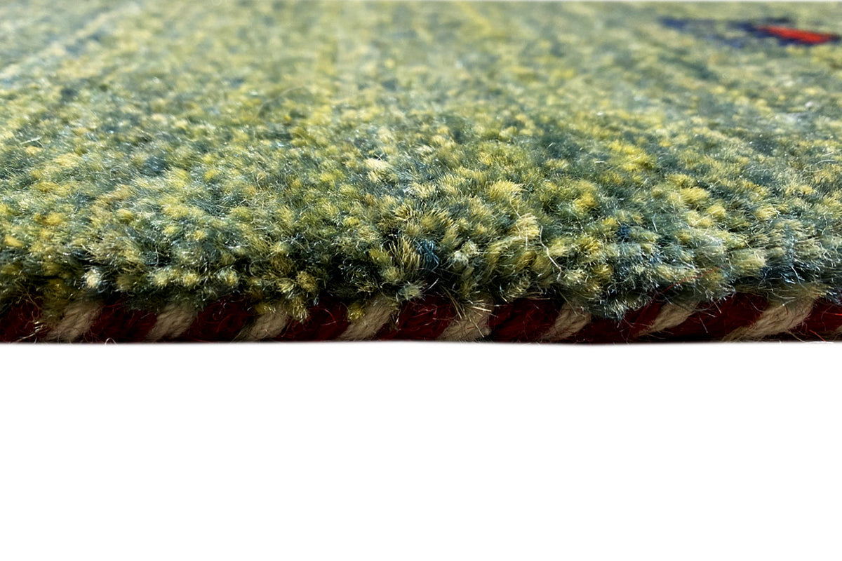 Close-up of the pile: dense, multicolored Gabbeh rug with a fine texture