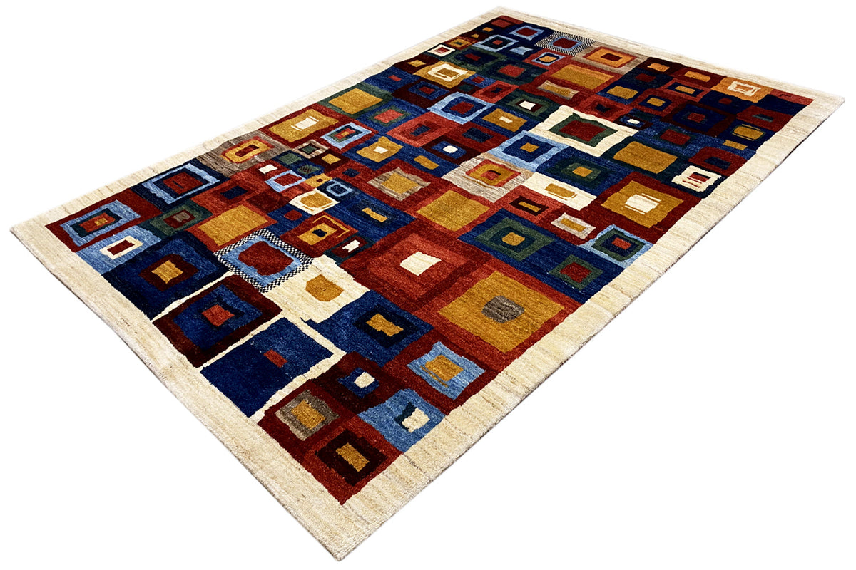 Rectangular Gabbeh rug with geometric squares in blue, red, yellow, and beige
