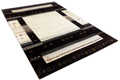 Gabbeh rug (298x196 cm) spread out at an angle with dark brown zones and cream-colored areas