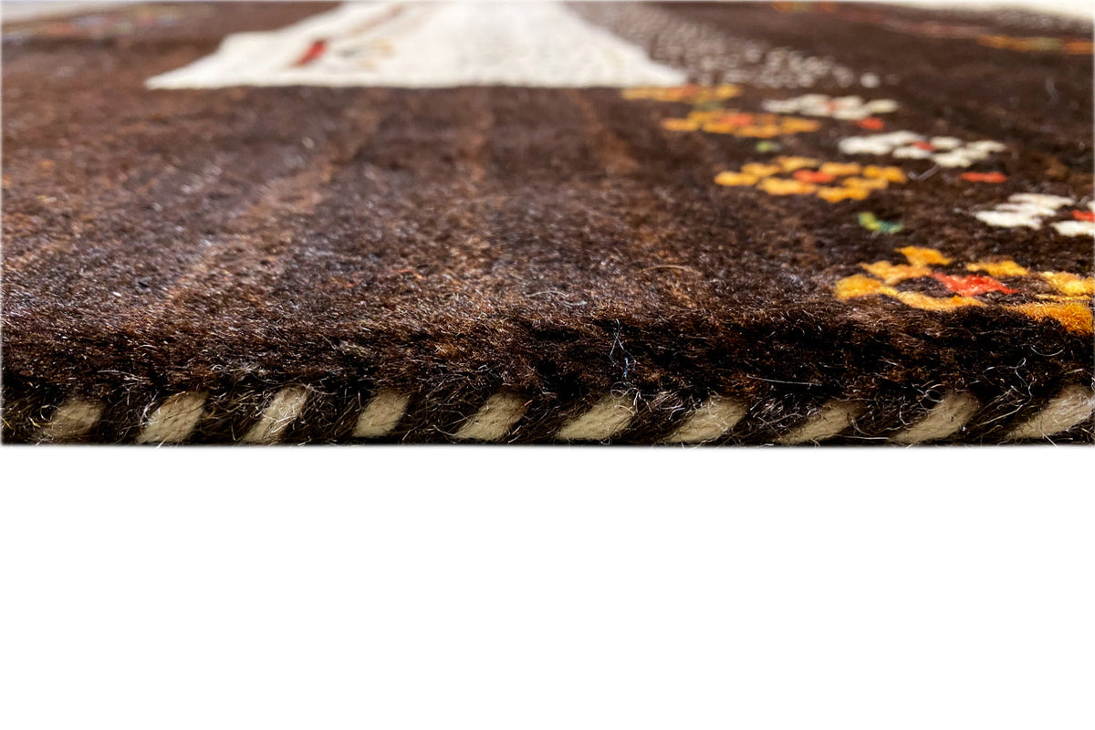Gabbeh rug (298x196 cm), close-up of the pile surface with dark and cream-colored areas