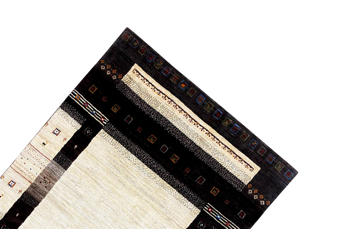 Gabbeh rug (298x196 cm) Detail of the corner border with colorful small graphics and stripes