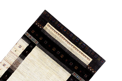 Gabbeh rug (298x196 cm) Detail of the corner border with colorful small graphics and stripes