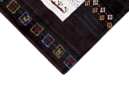 Gabbeh rug (298x196 cm), close-up of the lower corner with multicolored square patterns
