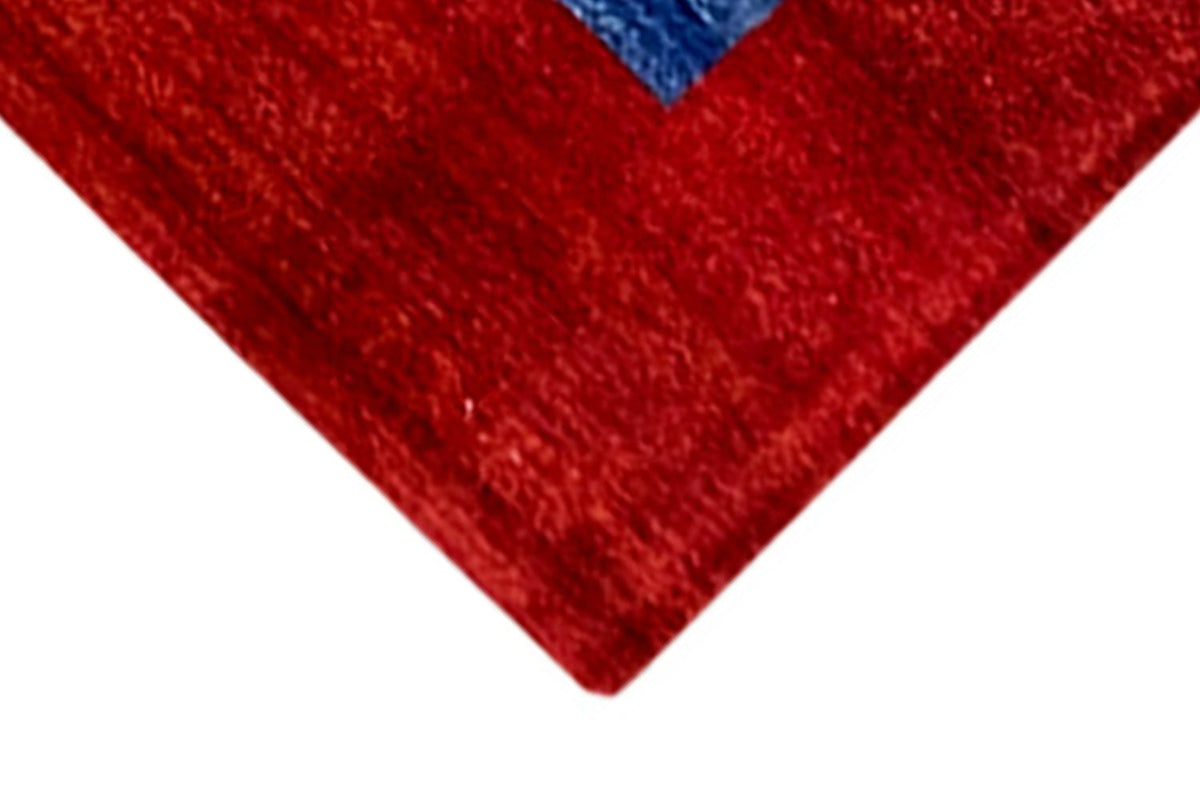 Gabbeh rug 302x202 cm, detail of the red corner with visible pile texture