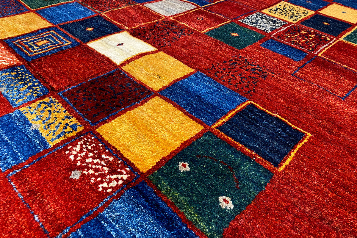 Gabbeh rug 302x202 cm detail view: red patchwork of blue and yellow squares
