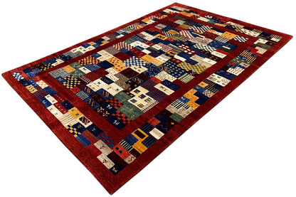 Carpet with a wide border in red and blue-beige fields, diagonal view